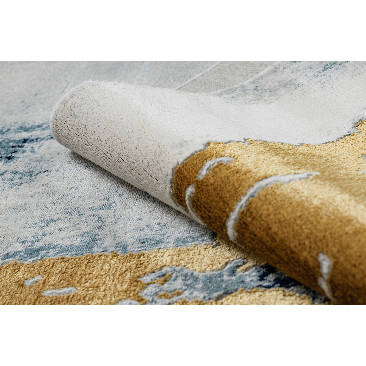 Covor original pentru living în culoarea albastru-aurie EMERALD