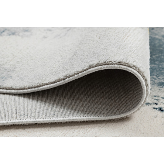 Covor original pentru living în culoarea albastru-aurie EMERALD