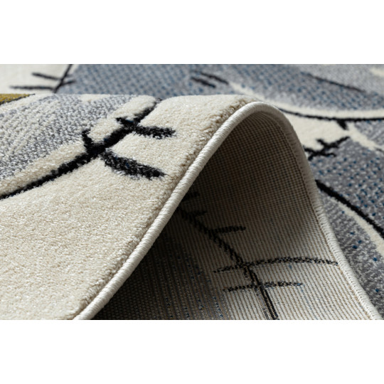 Un covor de calitate pentru copii de culoare bej cu un urs.