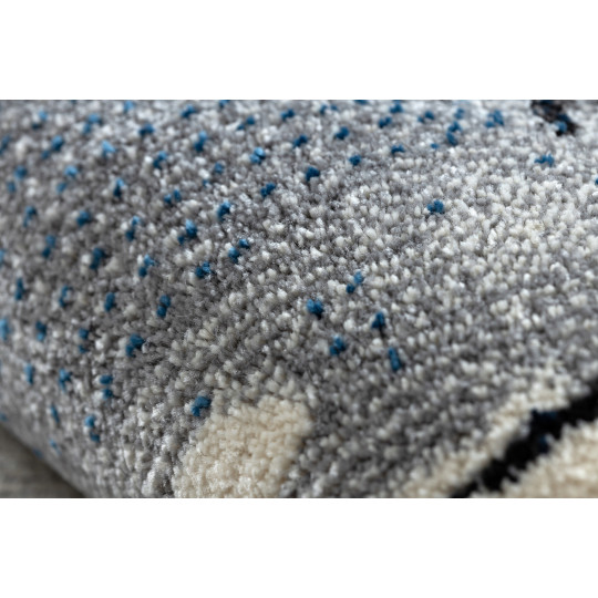 Un covor de calitate pentru copii de culoare bej cu un urs.