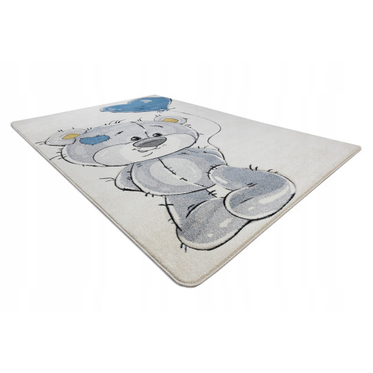 Un covor de calitate pentru copii de culoare bej cu un urs.