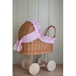 Carucior din material natural cu volan roz.