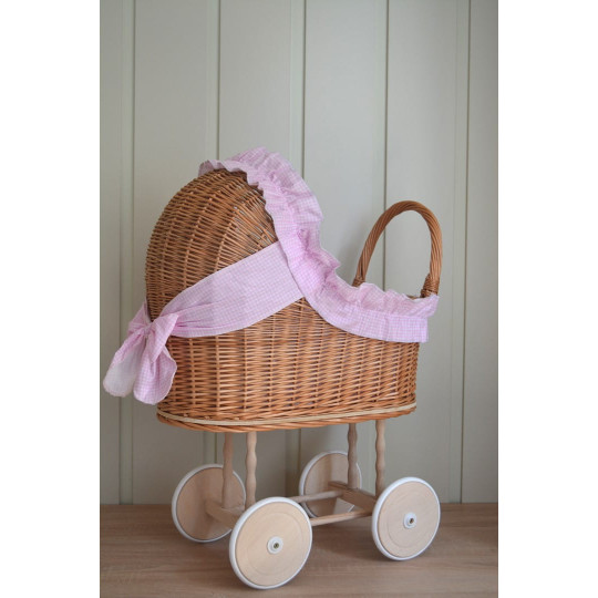 Carucior din material natural cu volan roz.