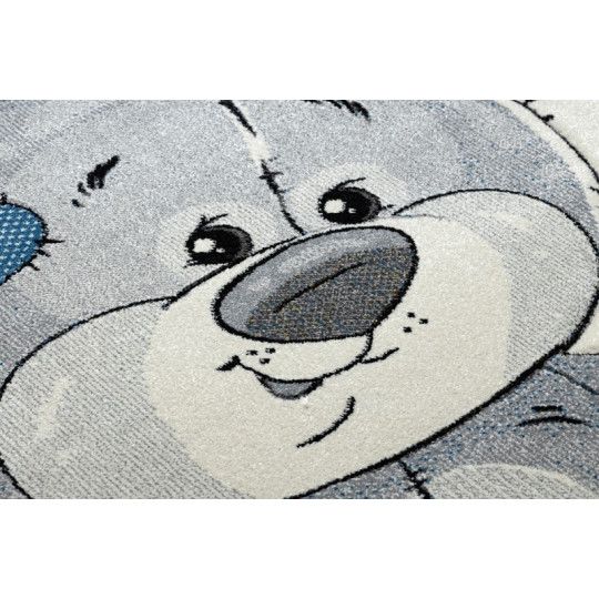 Un covor de calitate pentru copii de culoare bej cu un urs.