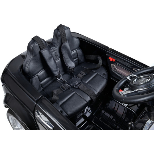 Mașină electrică de copil de calitate, cu comandă, de culoare neagră.