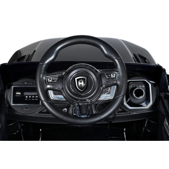 Mașină electrică de copil de calitate, cu comandă, de culoare neagră.